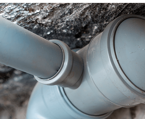Plumbing pipes under concrete drains and sewers